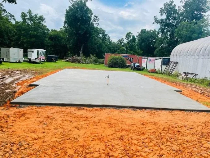Shop pad poured on graded red clay